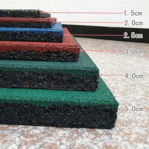 Plain black rubber flooring tile shown with a flecked tile