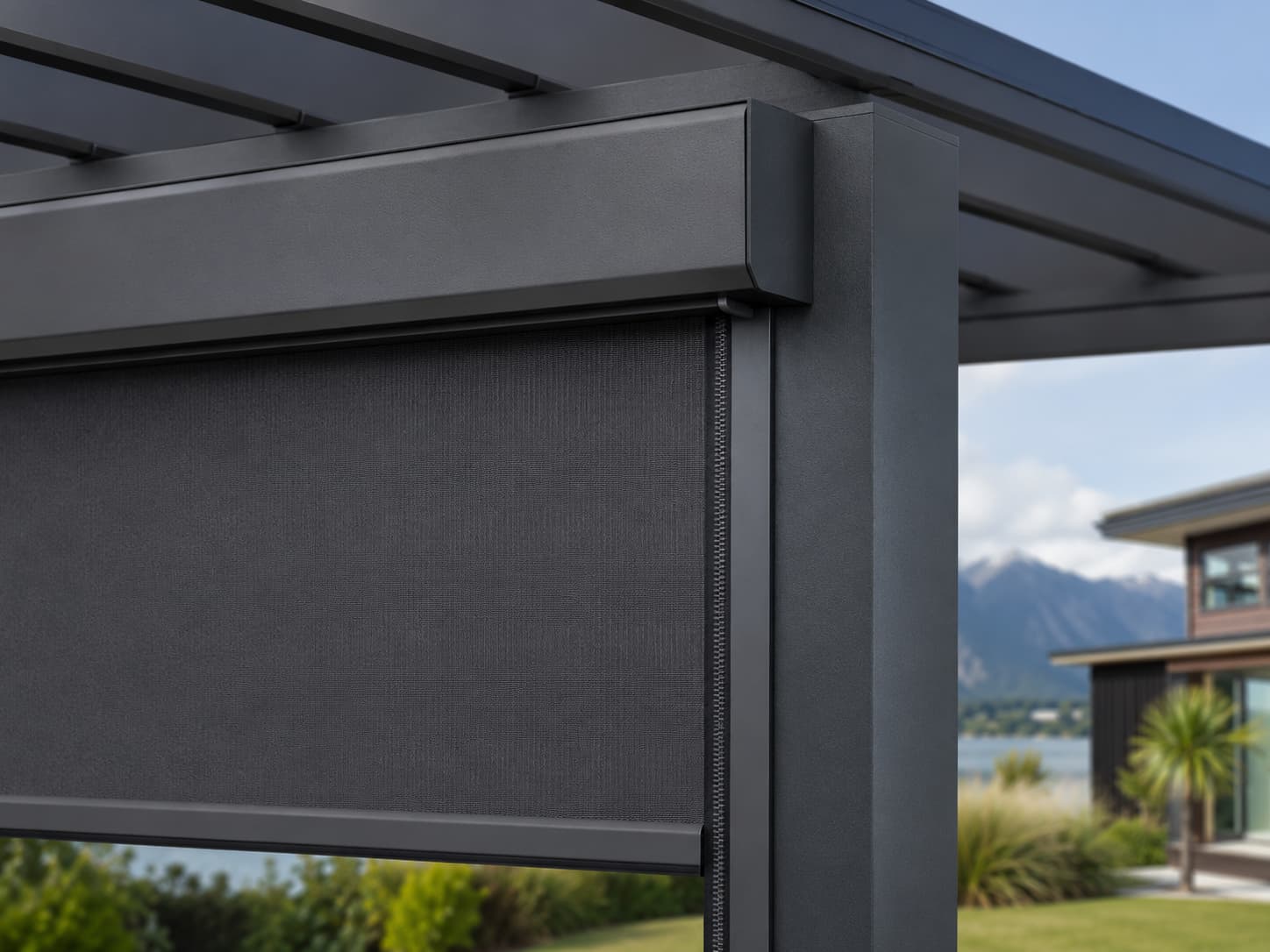Close detail of a dark Velaris outdoor blind cassette, side guide and bottom rail integrated into an outdoor structure