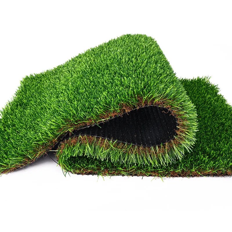 Artificial turf sample bent back to show pile depth and black backing