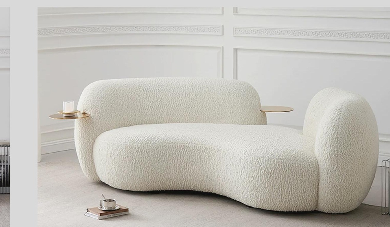 Cream sculptural sherpa two-seat sofa with integrated circular side trays