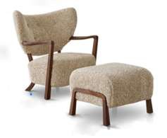 Cream textured Nordic lounge chair and matching ottoman with warm timber details