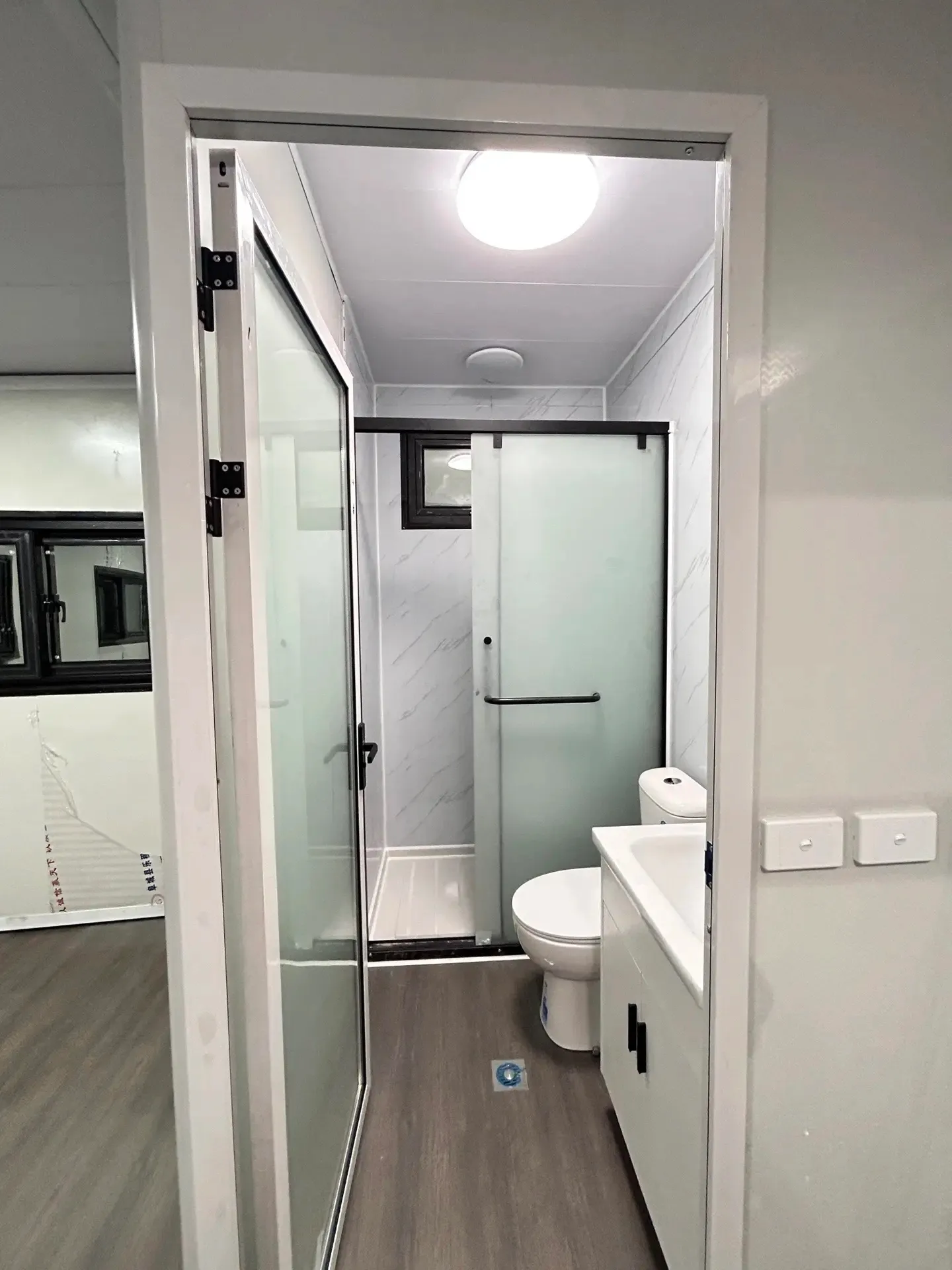 Compact Montara modular bathroom with shower toilet and vanity