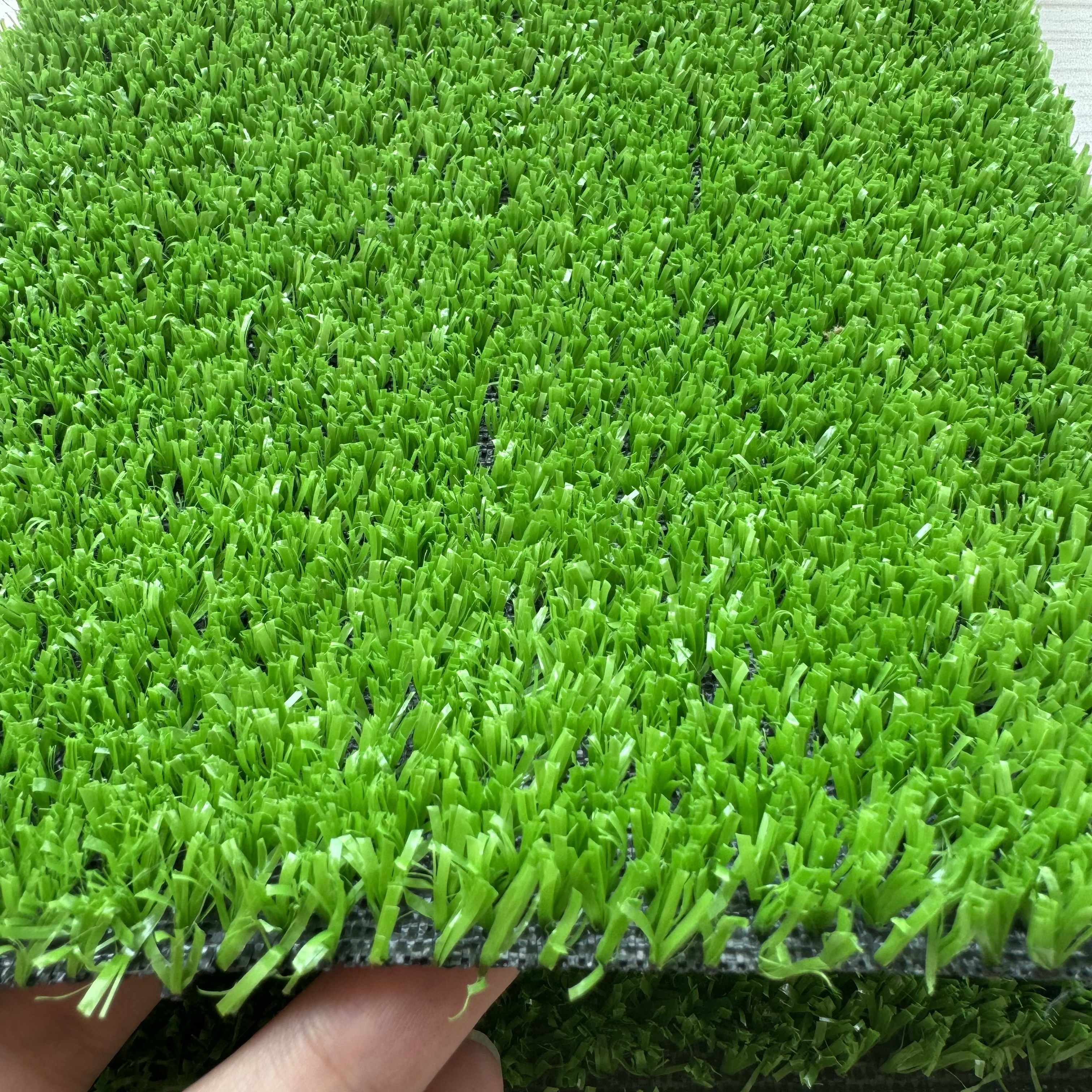 Dense short-pile artificial grass sample