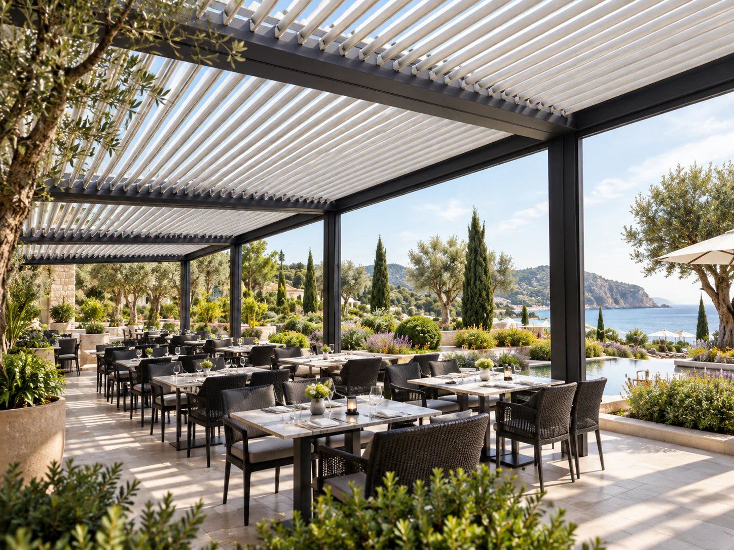 Commercial aluminium louvre roof over a landscaped resort restaurant terrace