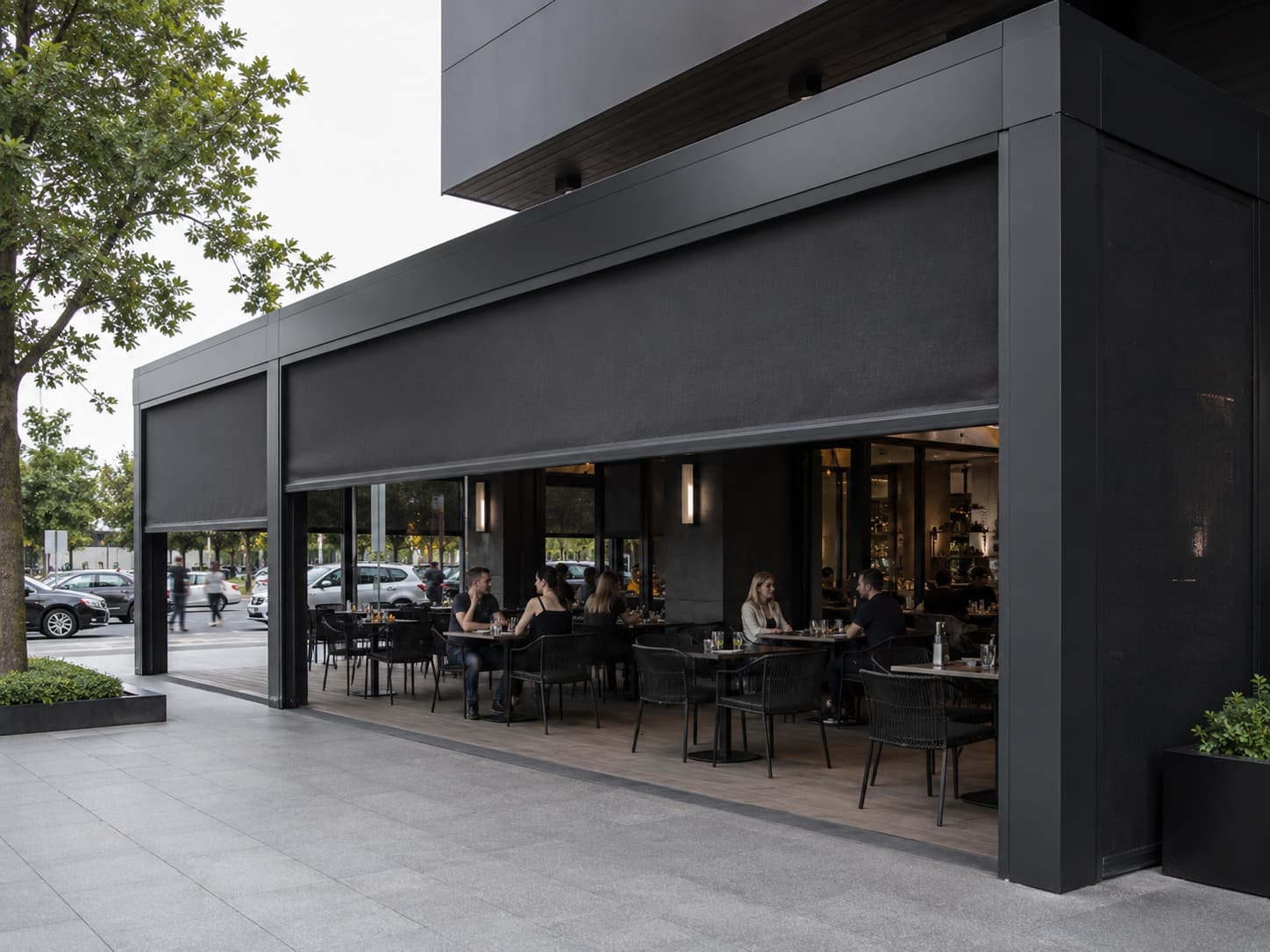 Velaris guided mesh blind spanning a large contemporary outdoor opening