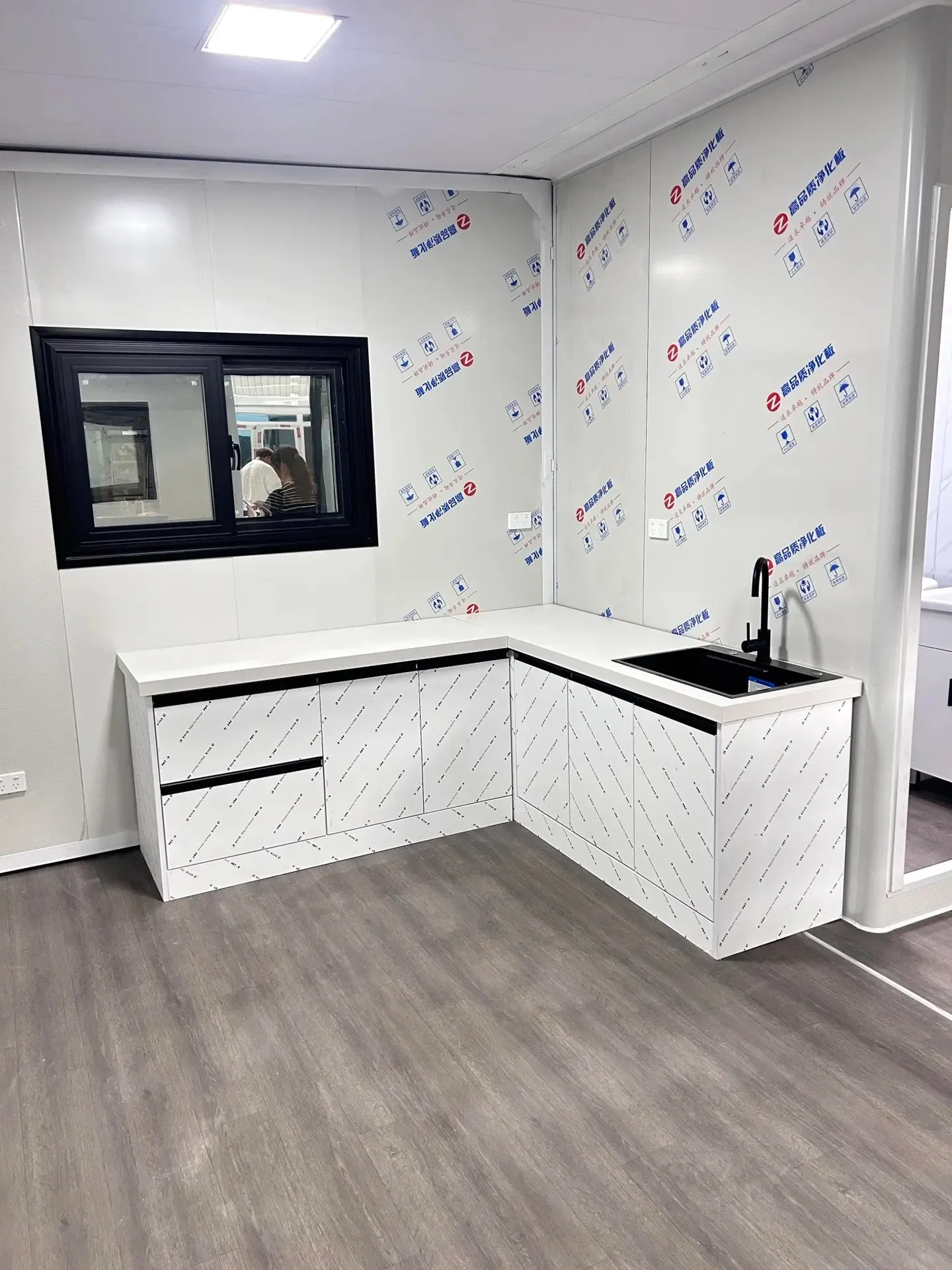 Compact Montara modular kitchen with L-shaped cabinetry and dark sink