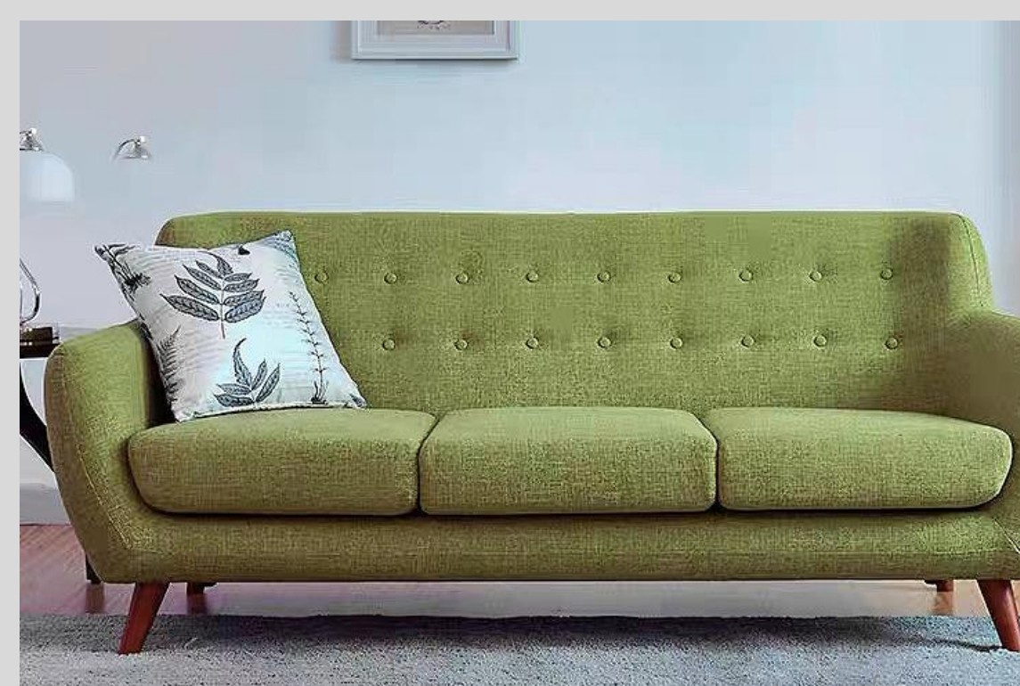 Olive green three-seat sofa with buttoned back and tapered timber legs