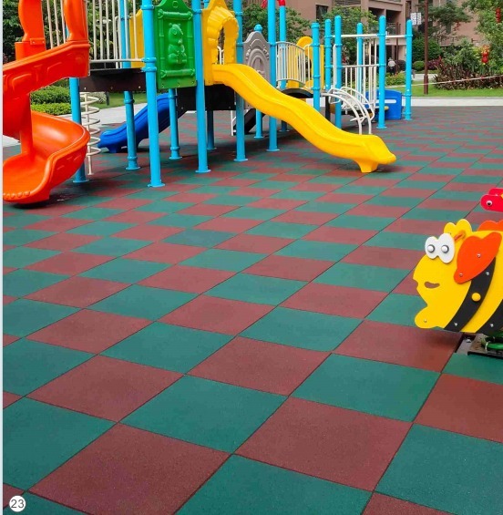 Outdoor playground using red and green rubber tile surfacing