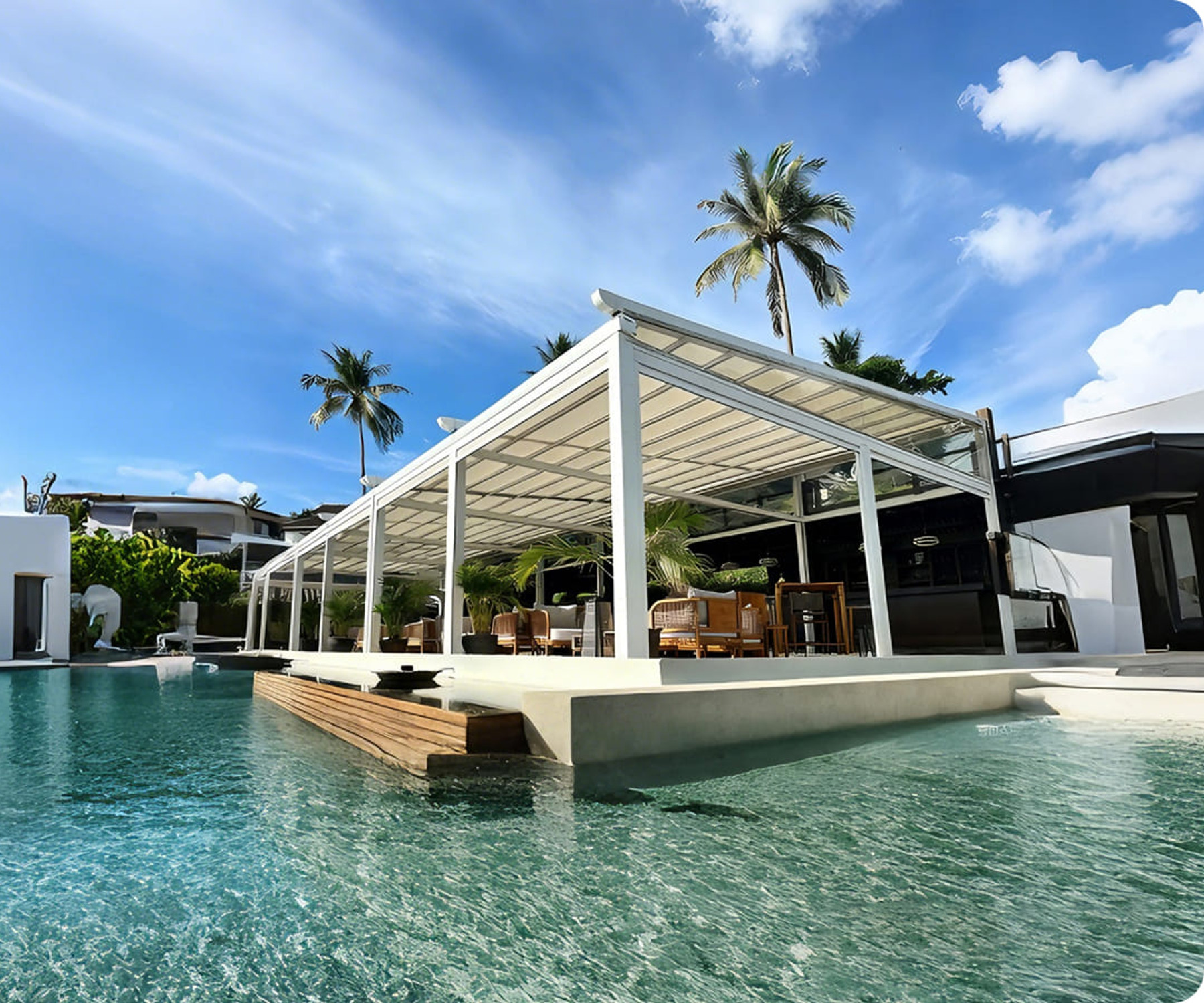 Large retractable waterproof fabric roof over a poolside resort dining terrace