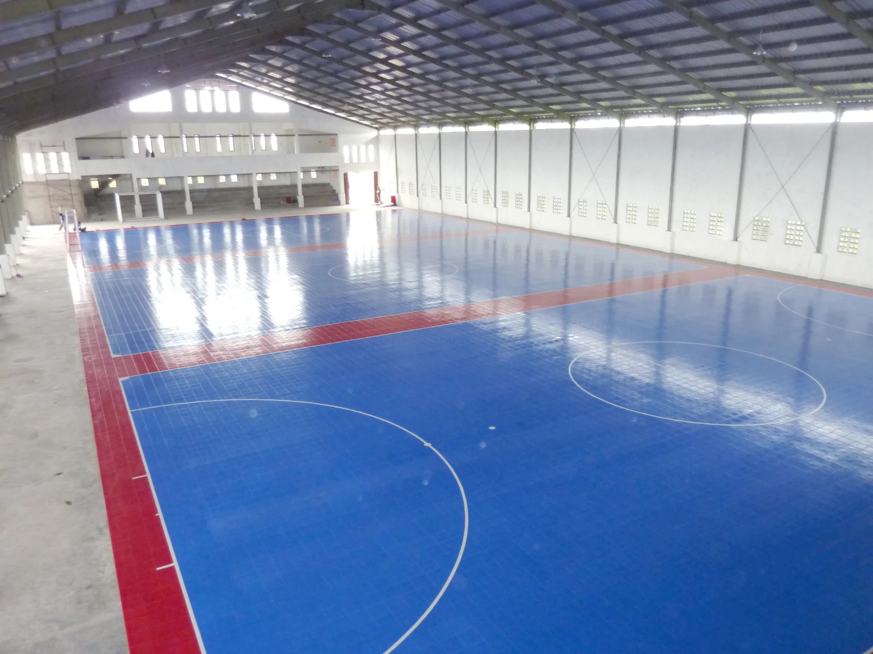 Large indoor blue and red modular futsal court