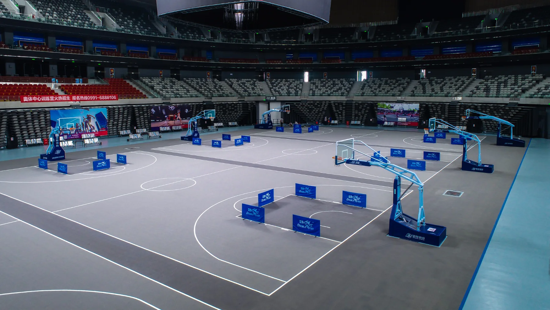 Indoor arena configured with multiple modular basketball courts